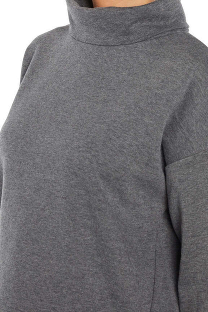 Alana Pullover, back view, showing visible design features and texture of the soft knit fabric.. 