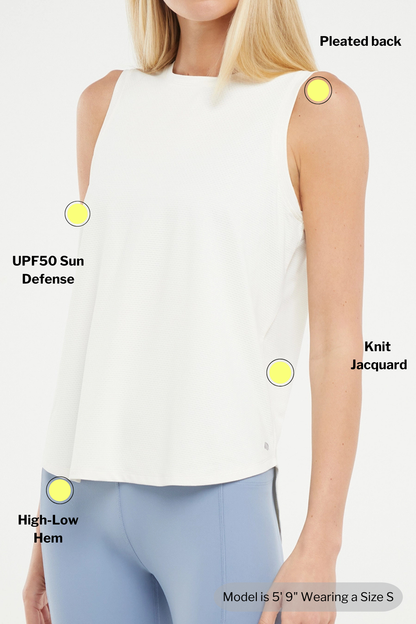 White sleeveless top with features labeled on a model wearing it. 