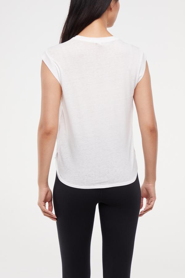 Leona Short Sleeve Top, side view showing pocket placement, showing visible design features and texture of the soft knit fabric.. 