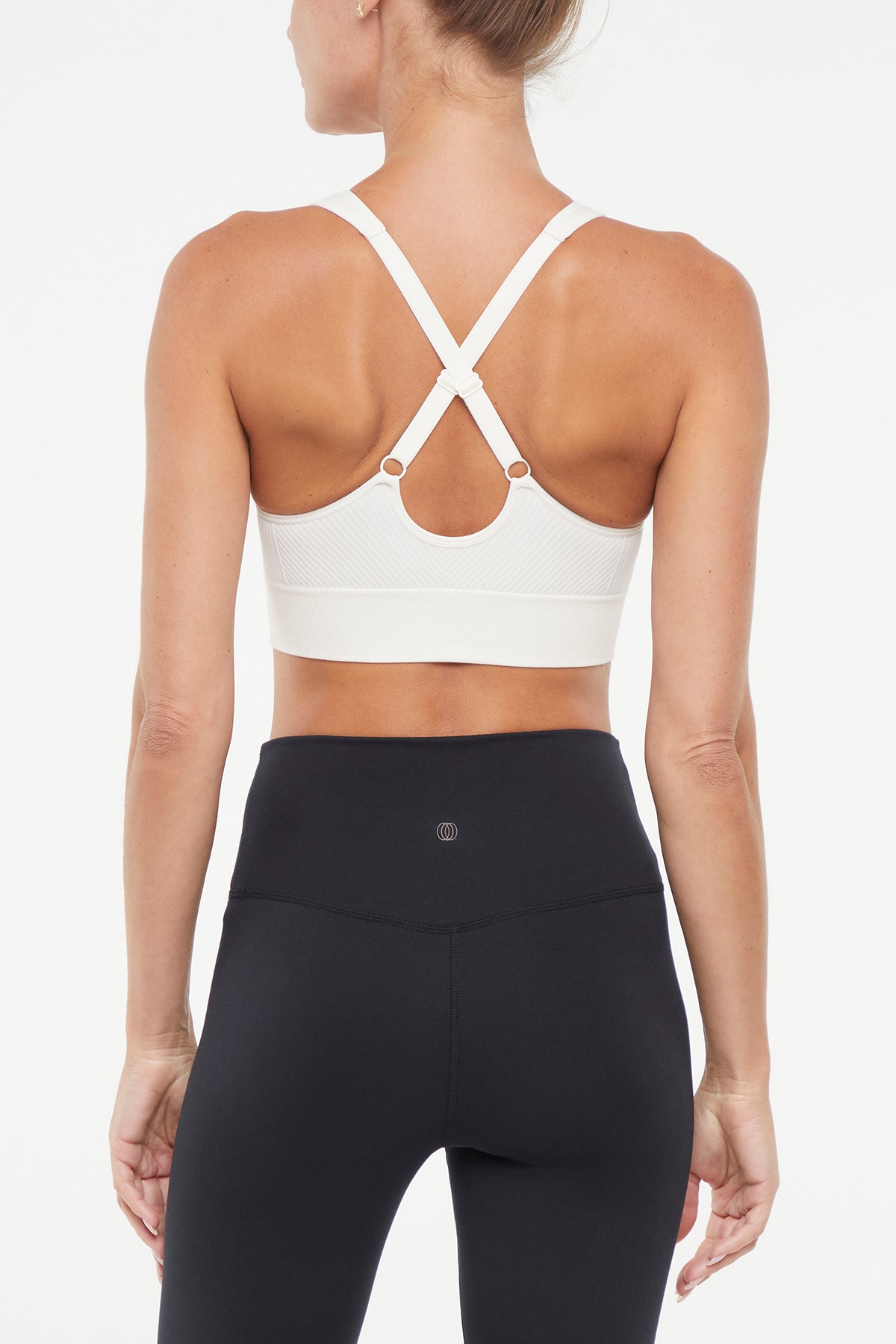 Addie Seamless Sports Bra, alternate angle view, showing visible design features and texture of the soft knit fabric.. 