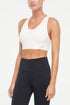Addie Seamless Sports Bra, alternate angle view, showing visible design features and texture of the soft knit fabric.. 