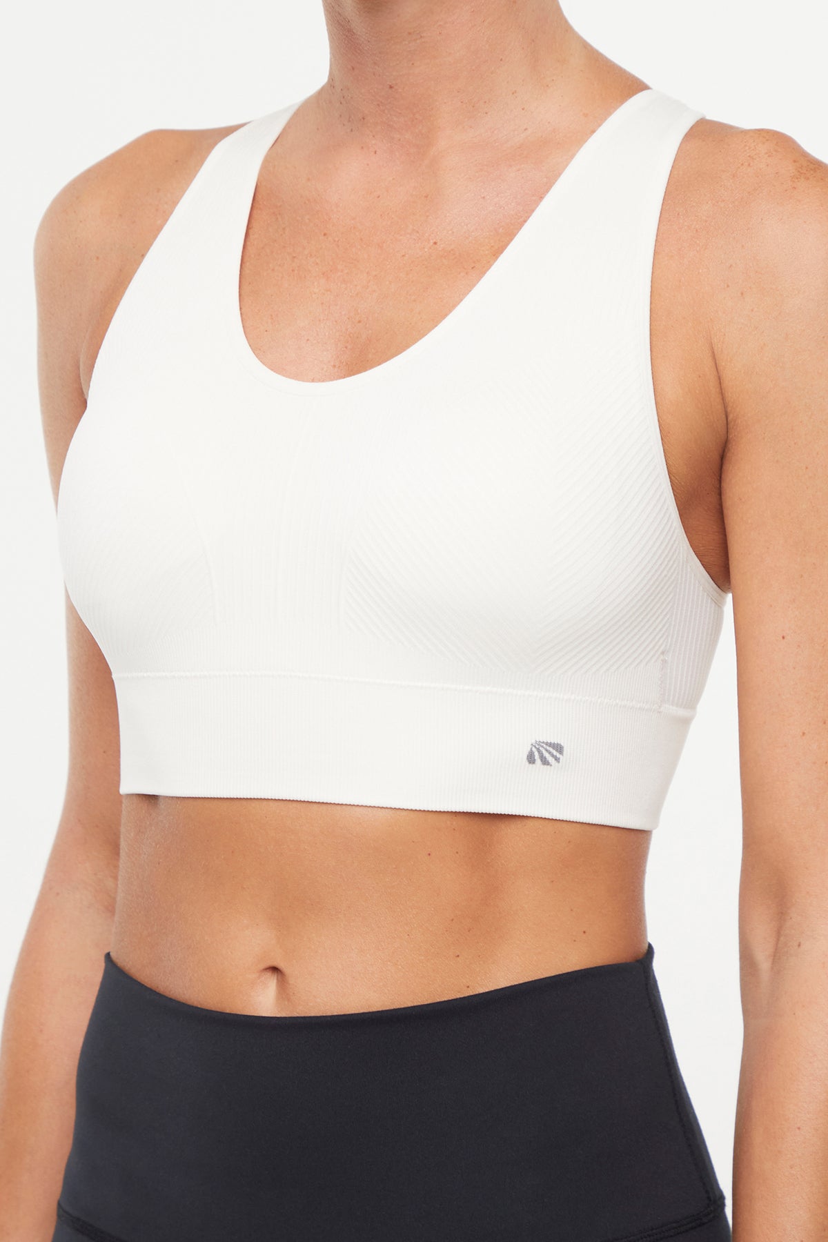 Addie Seamless Sports Bra, alternate angle view, showing visible design features and texture of the soft knit fabric.. 