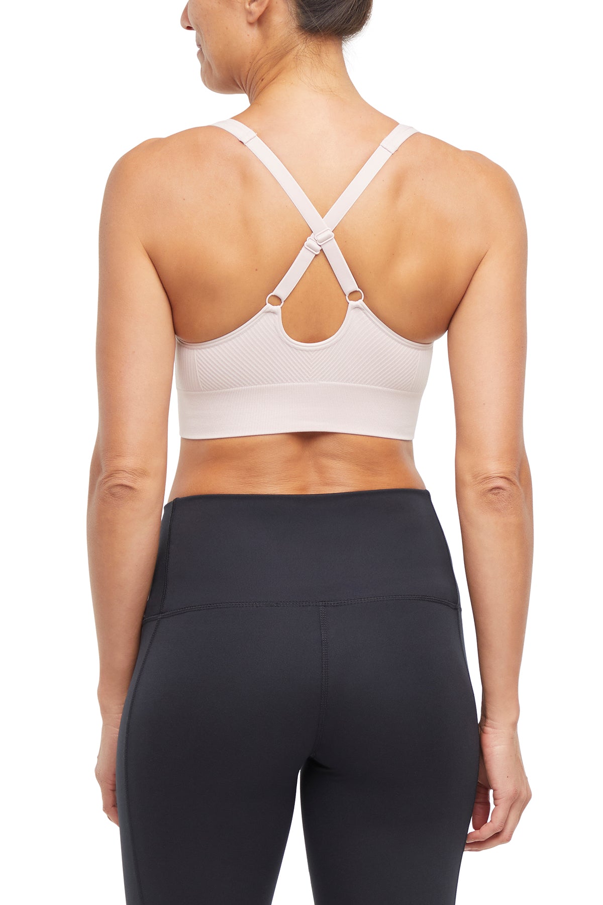 Addie Seamless Sports Bra, close-up view of fabric and stitching, showing visible design features and texture of the soft knit fabric.. 