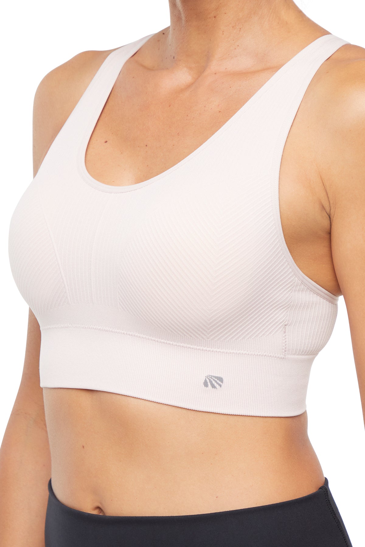 Addie Seamless Sports Bra, alternate angle view, showing visible design features and texture of the soft knit fabric.. 