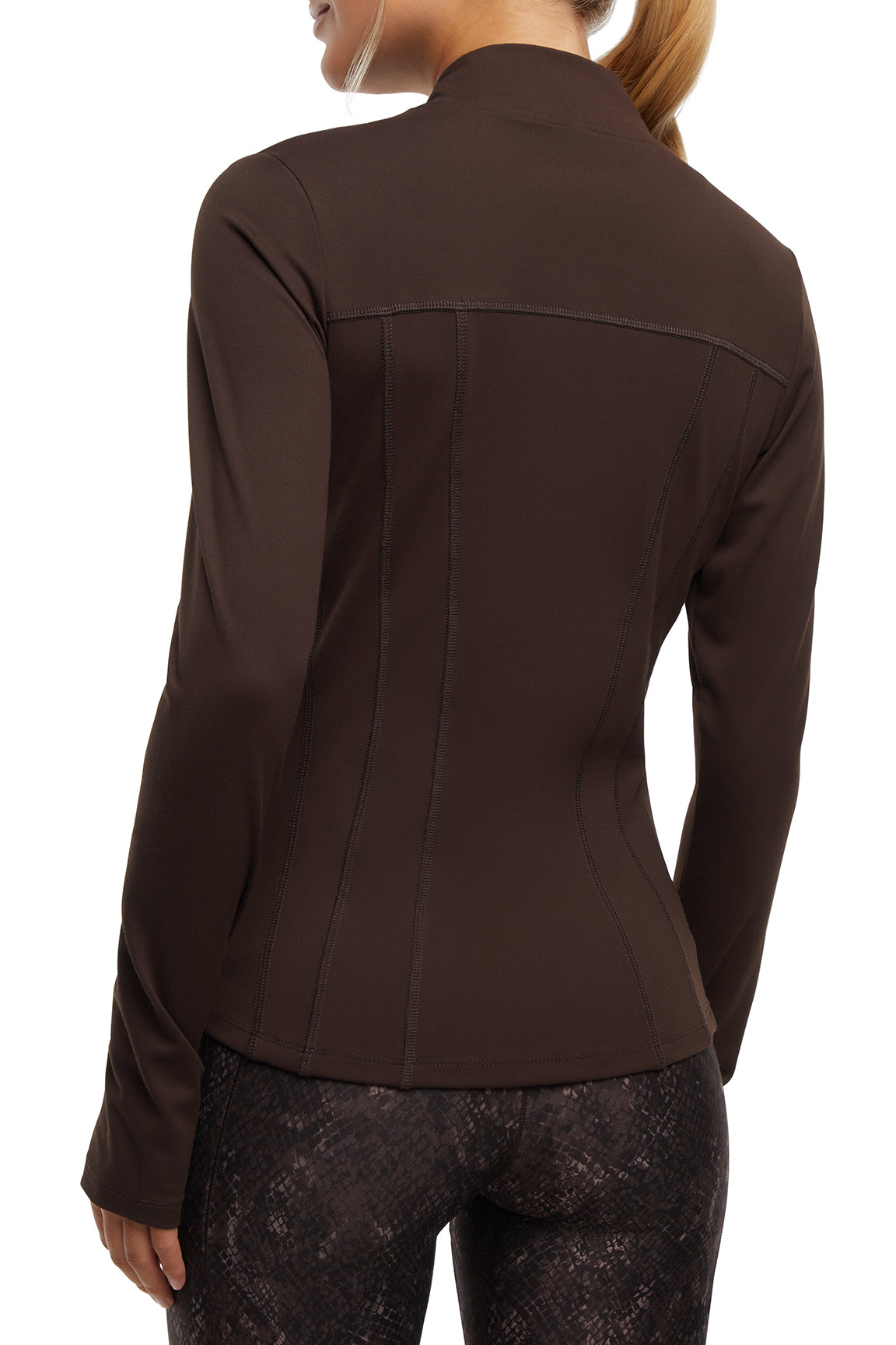 Kate Jacket, side view showing pocket placement, showing visible design features and texture of the smooth woven fabric.. 