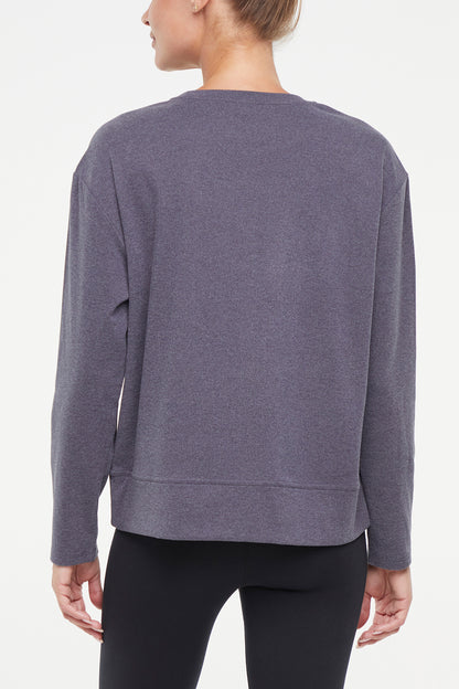 Riley Pullover, side view showing pocket placement, showing visible design features and texture of the soft knit fabric.. 