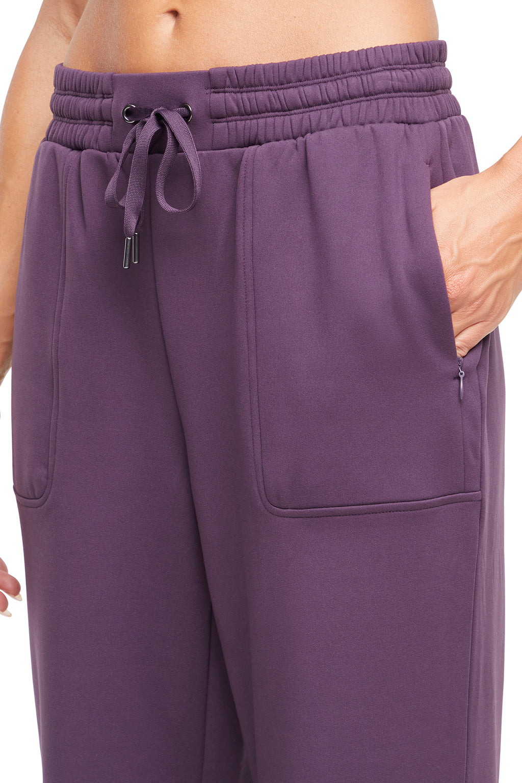 Mia Pant, close-up view of fabric and stitching, showing visible design features and texture of the durable stretch fabric.. #color_plum-perfect