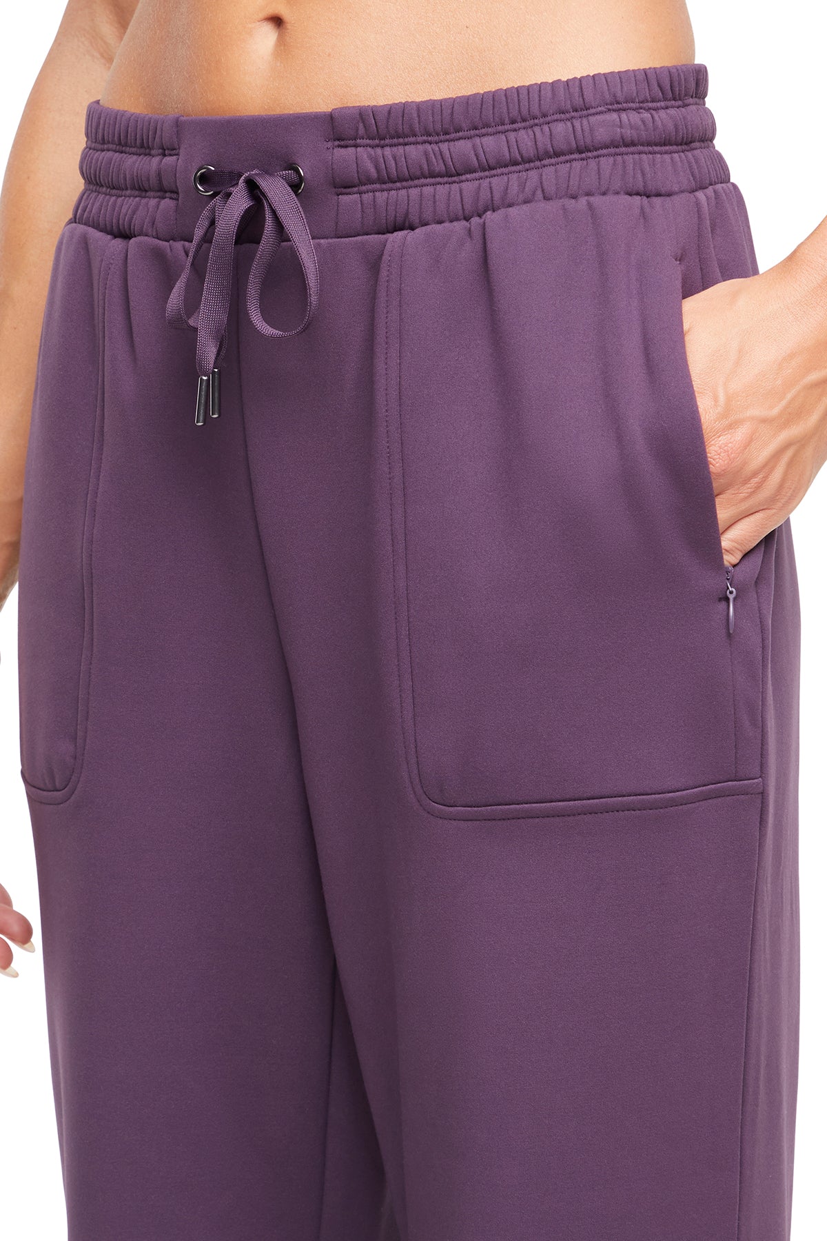 Mia Pant, close-up view of fabric and stitching, showing visible design features and texture of the durable stretch fabric.. 