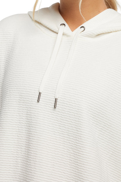 Cora Pullover Hoodie, alternate angle view, showing visible design features and texture of the soft fleece fabric.. 