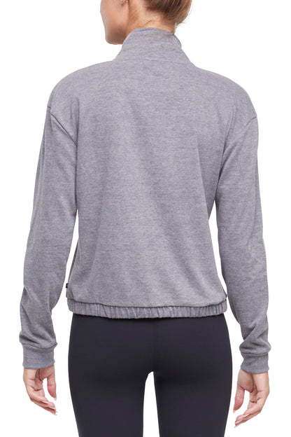 Lyla 1/2 Zip Pullover, side view showing pocket placement, showing visible design features and texture of the soft knit fabric.. 