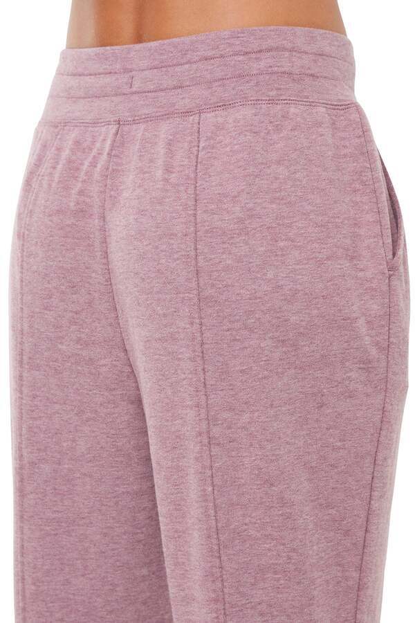 Lyla Jogger, side view showing pocket placement, showing visible design features and texture of the soft knit fabric.. #color_heather-fig
