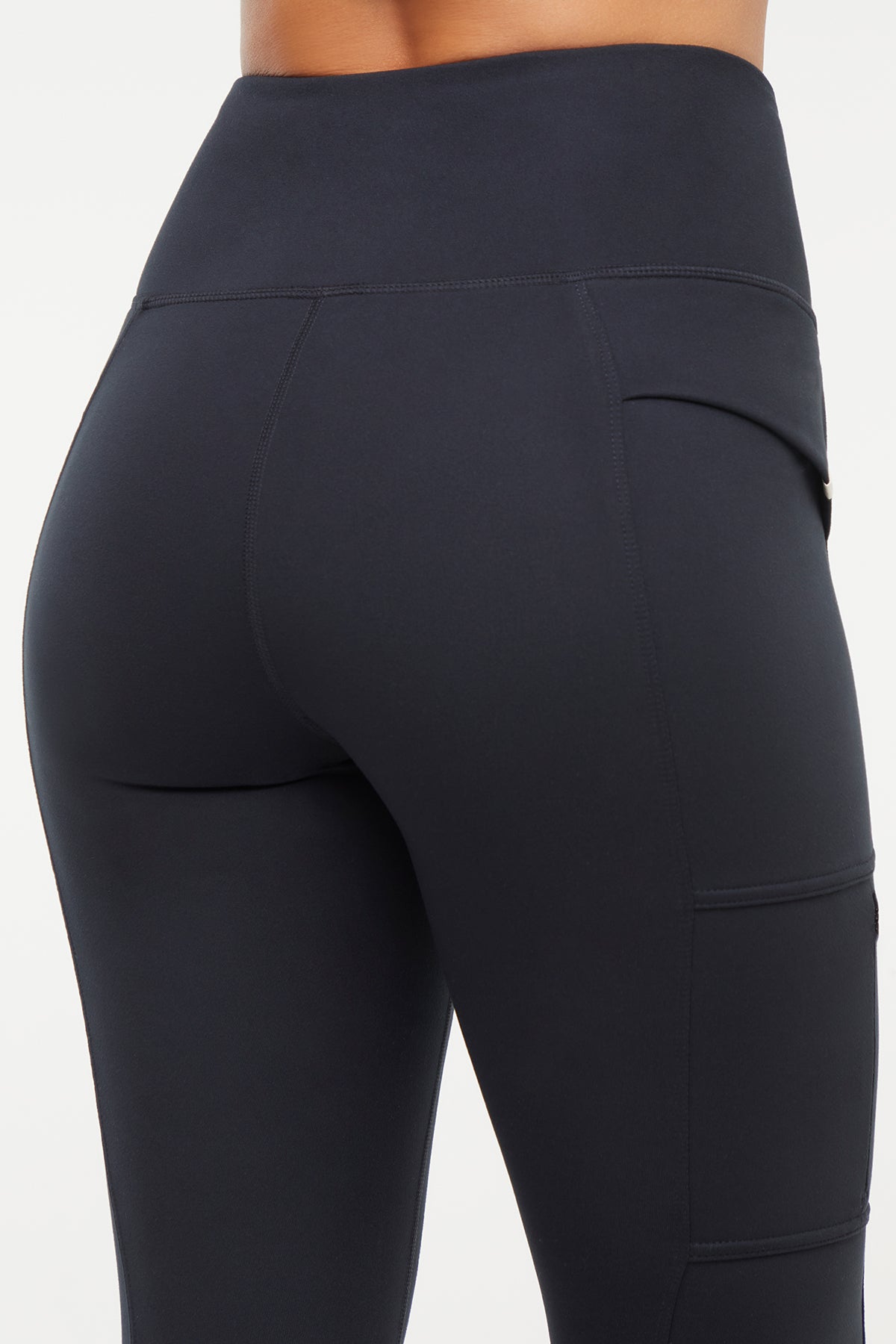 Faye Side Pocket Legging, alternate angle view, showing visible design features and texture of the stretch knit fabric.. 