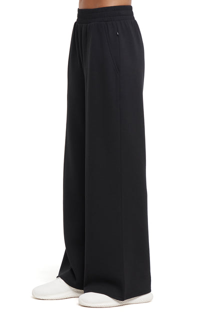Sage Wide Leg Pant, alternate angle view, showing visible design features and texture of the durable stretch fabric.. 