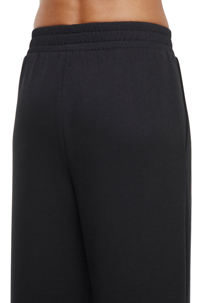 Sage Wide Leg Pant, alternate angle view, showing visible design features and texture of the durable stretch fabric.. 