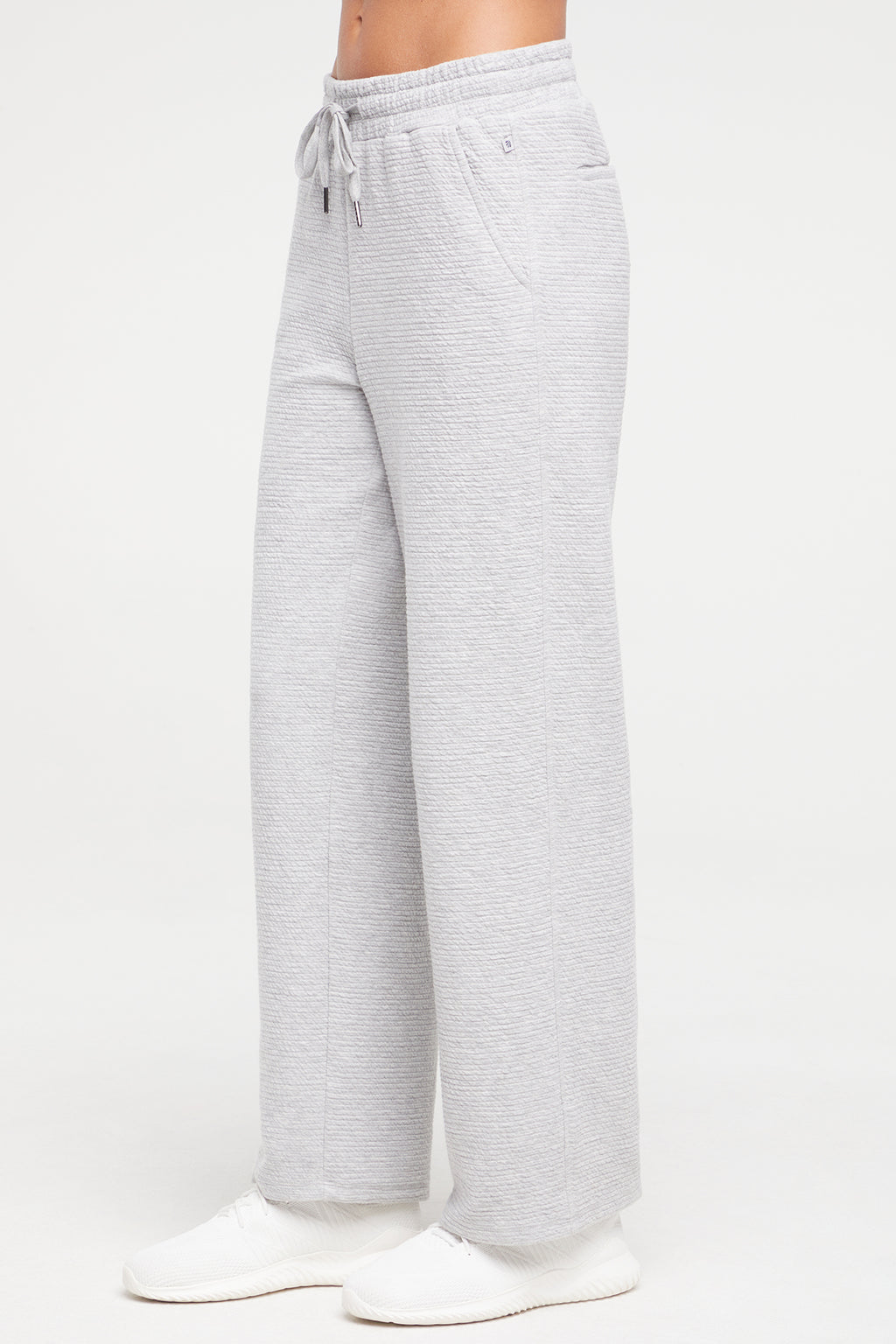Freyi Pant, alternate angle view, showing visible design features and texture of the durable stretch fabric.. #color_heather-grey