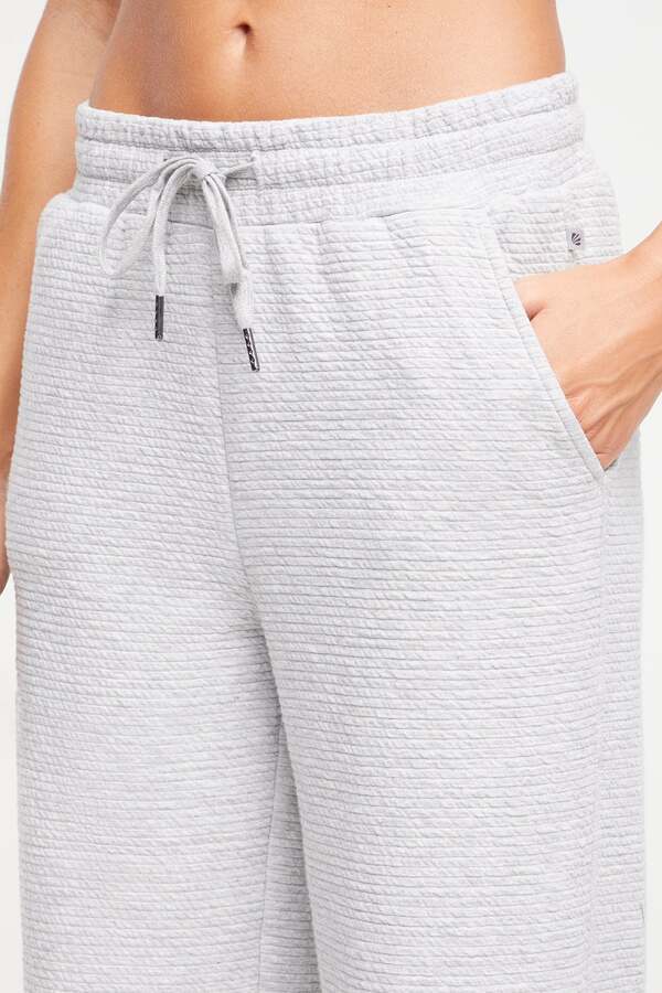 Freyi Pant, alternate angle view, showing visible design features and texture of the durable stretch fabric.. #color_heather-grey