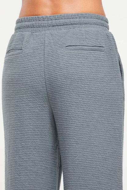 Freyi Pant, back view, showing visible design features and texture of the durable stretch fabric.. 