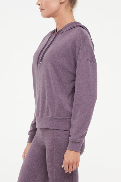 Riley Hoodie, alternate angle view, showing visible design features and texture of the soft fleece fabric.. 