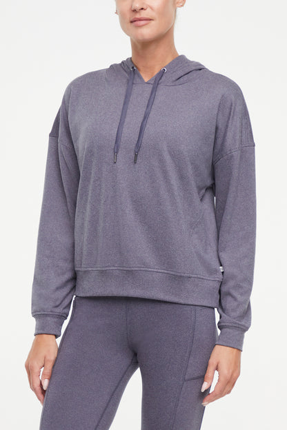Riley Hoodie, alternate angle view, showing visible design features and texture of the soft fleece fabric.. 
