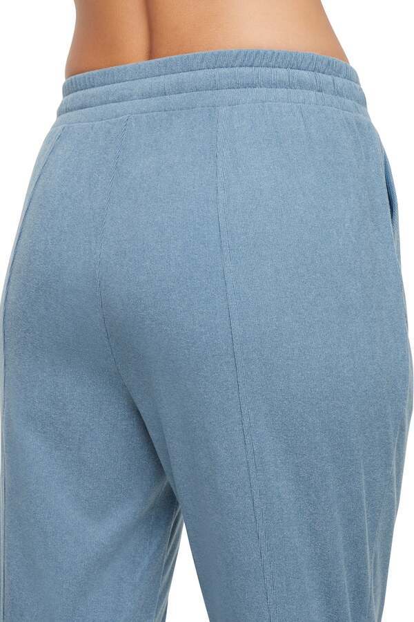 Riley Jogger, side view showing pocket placement, showing visible design features and texture of the soft knit fabric.. 