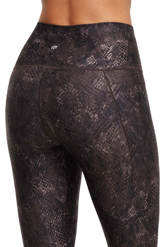 Kelly Side Pocket Legging, side view showing pocket placement, showing visible design features and texture of the stretch knit fabric.. 