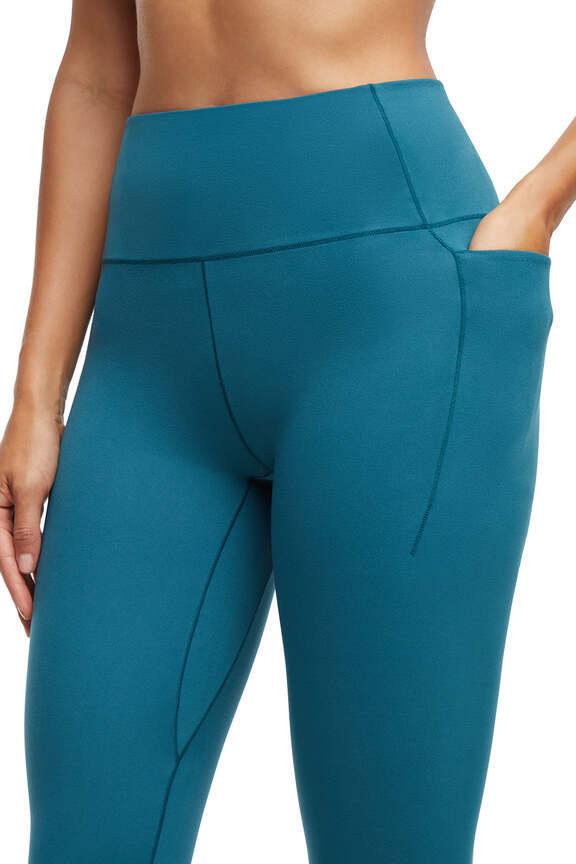 Kelly Side Pocket Legging, alternate angle view, showing visible design features and texture of the stretch knit fabric.. #color_green-heron
