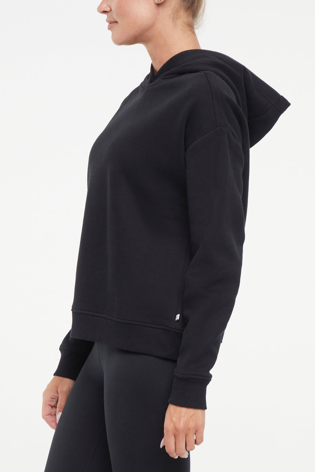 Camila Hoodie, alternate angle view, showing visible design features and texture of the soft fleece fabric.. #color_black