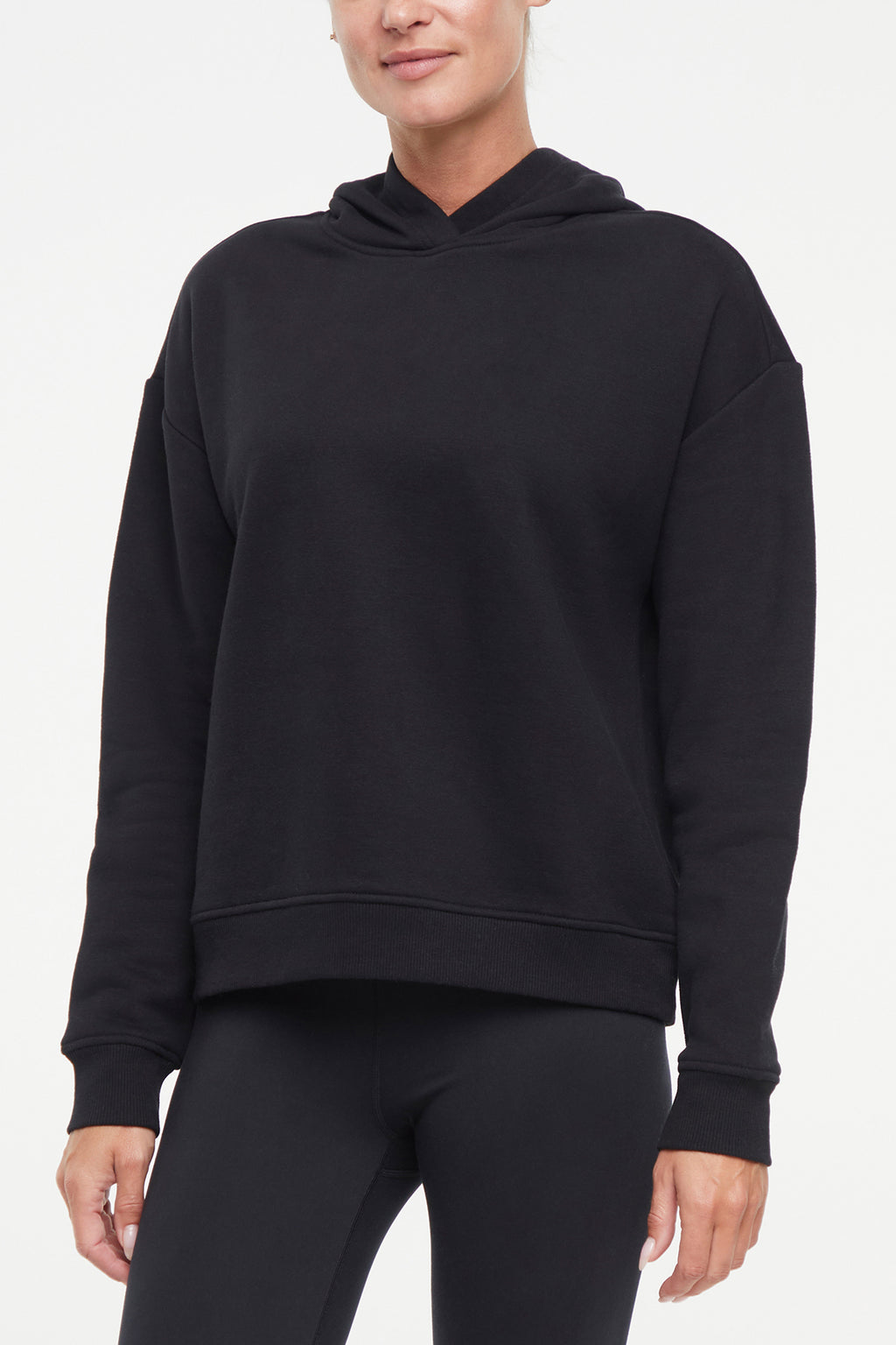 Camila Hoodie, front view, showing visible design features and texture of the soft fleece fabric.. #color_black