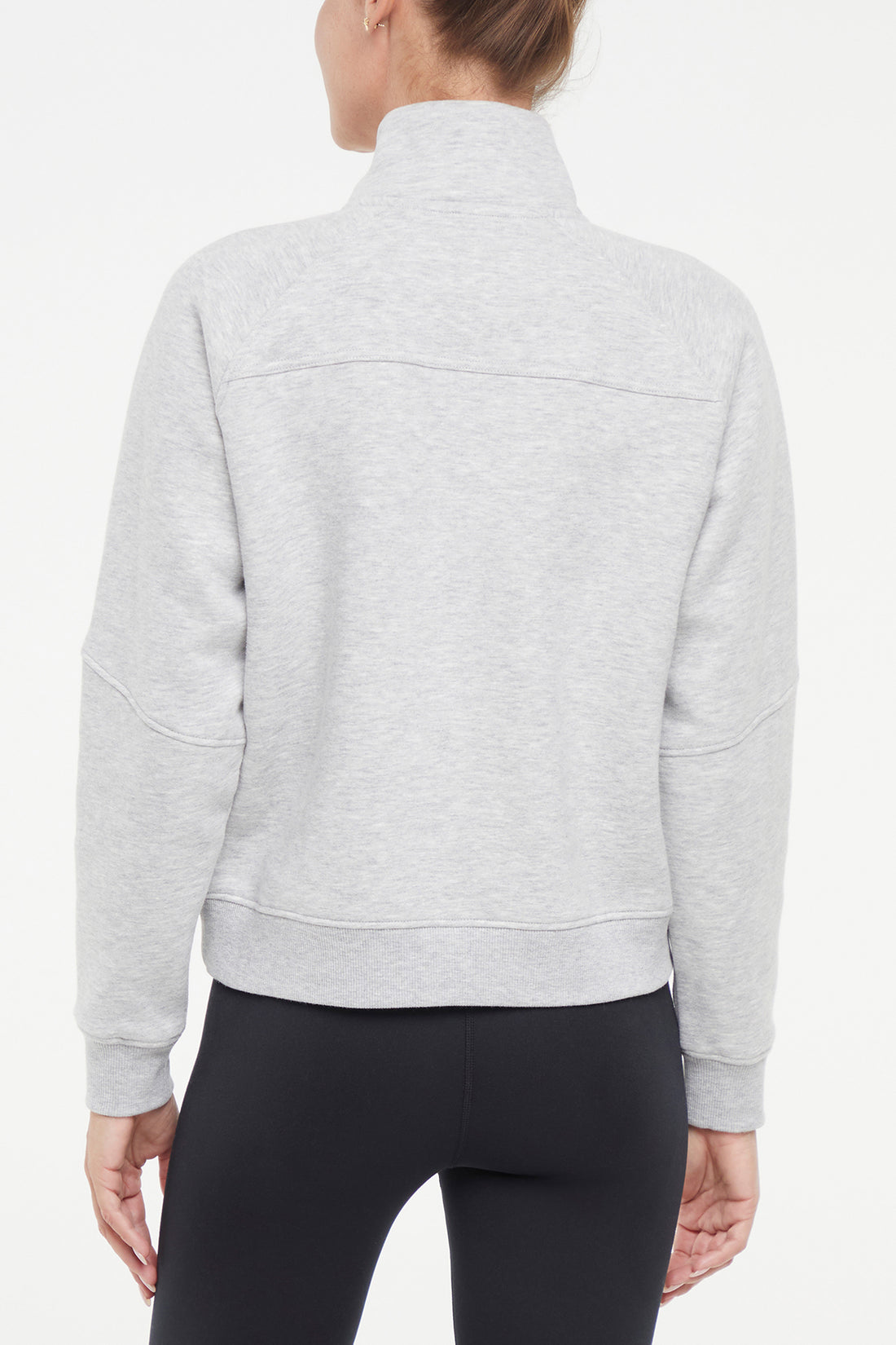 Camila 1/4 Zip Jacket, alternate angle view, showing visible design features and texture of the smooth woven fabric.. 