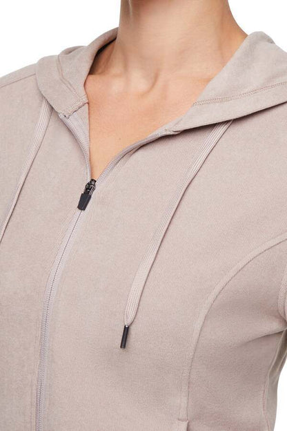 Riley Full Zip Hoodie, close-up view of fabric and stitching, showing visible design features and texture of the soft fleece fabric.. 