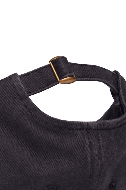 Ruby Canvas Hat - Black, side view showing pocket placement, showing visible design features and texture of the soft knit fabric.. 