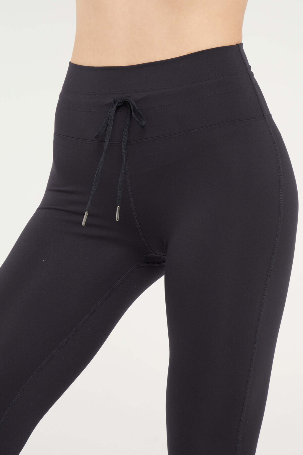 Lune Legging, alternate angle view, showing visible design features and texture of the stretch knit fabric.. #color_black