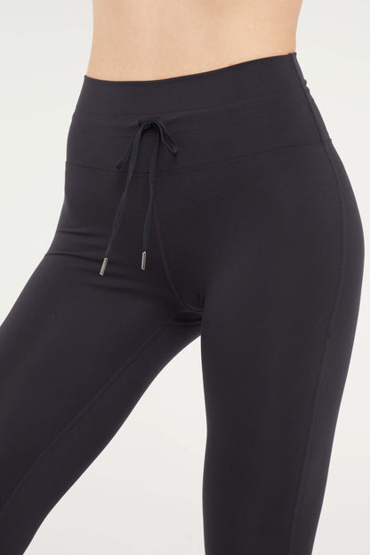 Lune Legging, alternate angle view, showing visible design features and texture of the stretch knit fabric.. 