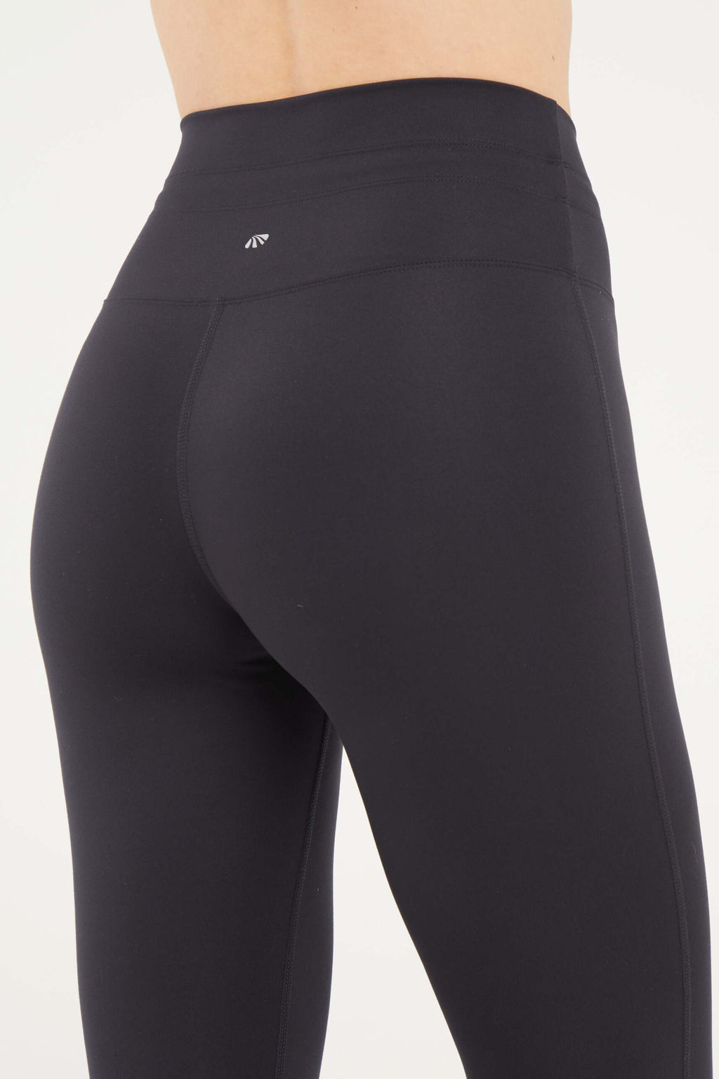 Lune Legging, alternate angle view, showing visible design features and texture of the stretch knit fabric.. #color_black