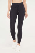 Lune Legging, alternate angle view, showing visible design features and texture of the stretch knit fabric.. #color_black