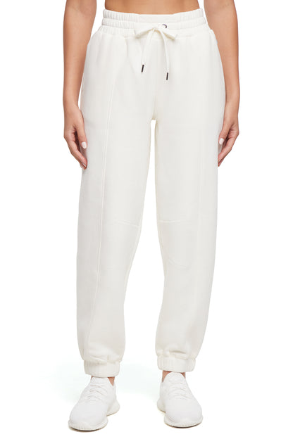 Calliope Jogger, close-up view of fabric and stitching, showing visible design features and texture of the soft knit fabric.. 