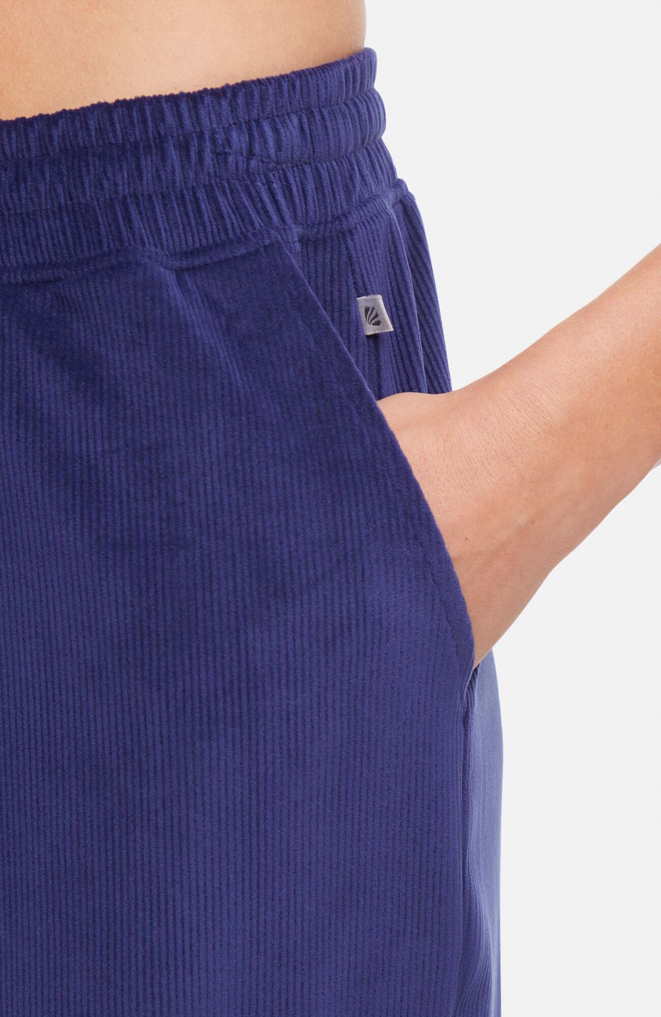 Stormi Pant, close-up view of fabric and stitching, showing visible design features and texture of the durable stretch fabric.. 