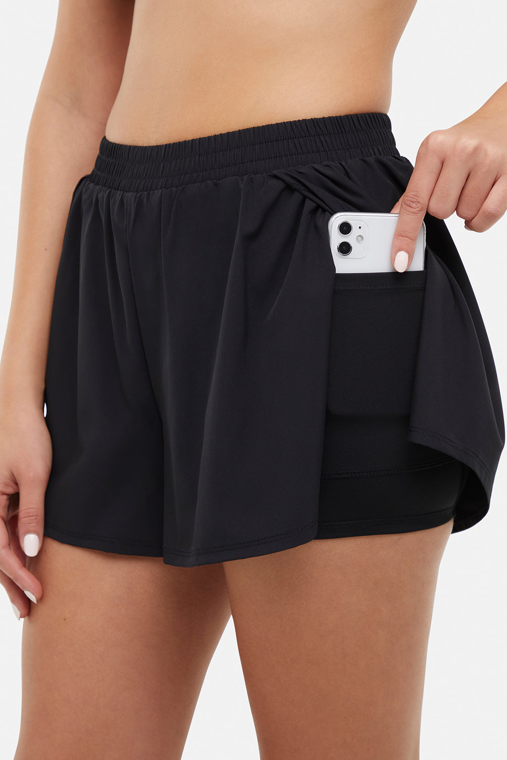 Tara Woven Short, side view showing pocket placement, showing visible design features and texture of the soft knit fabric. #color_black