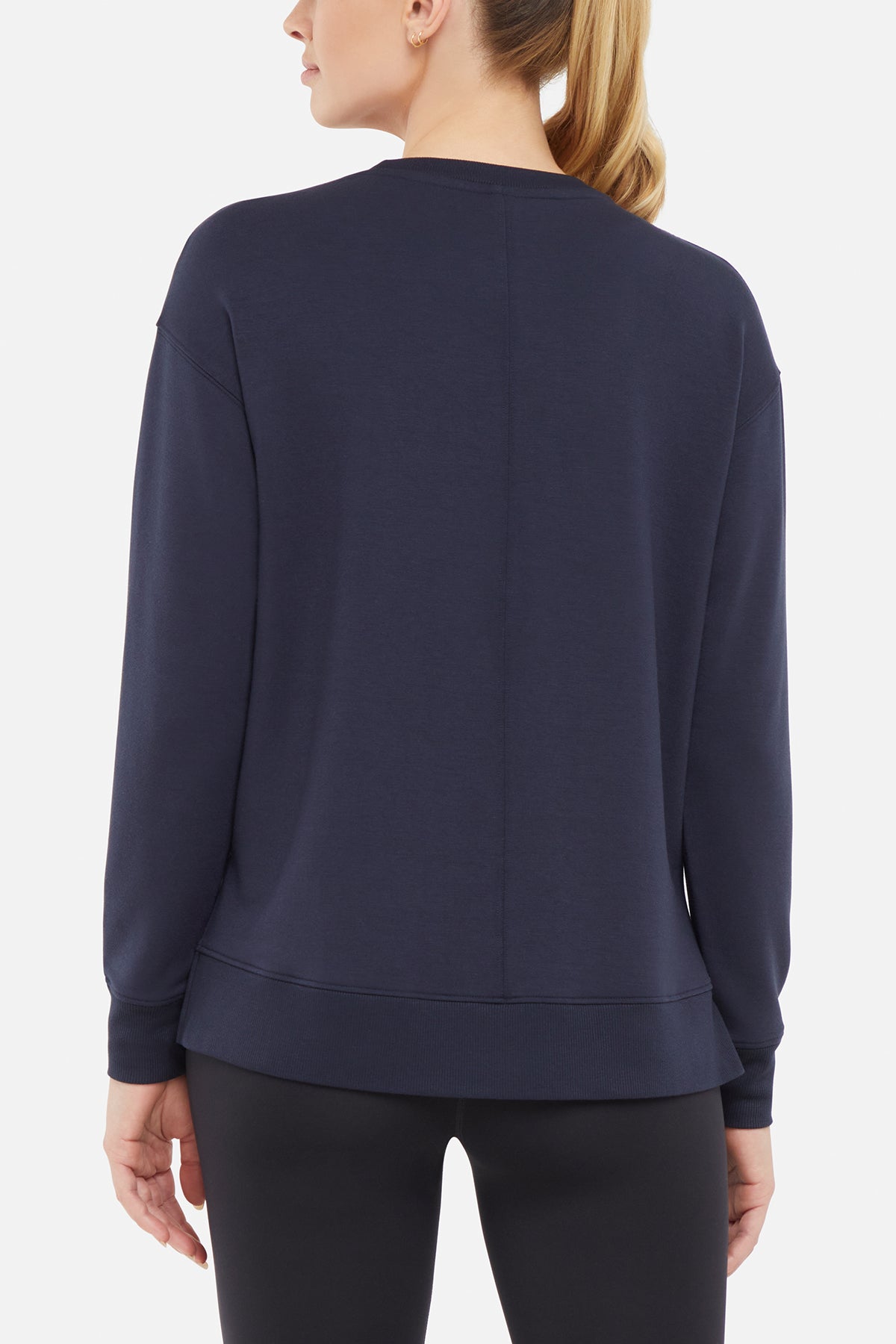 Maisha Long Sleeve Pullover, side view showing pocket placement, showing visible design features and texture of the soft knit fabric.. 