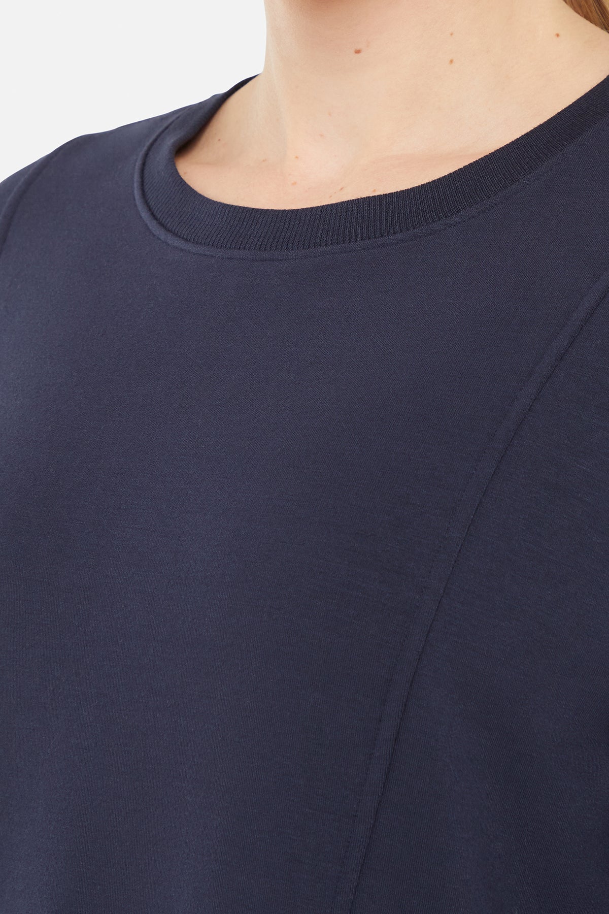Maisha Long Sleeve Pullover, close-up view of fabric and stitching, showing visible design features and texture of the soft knit fabric.. 