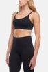 Alba Sports Bra, front view, showing visible design features and texture of the soft knit fabric.