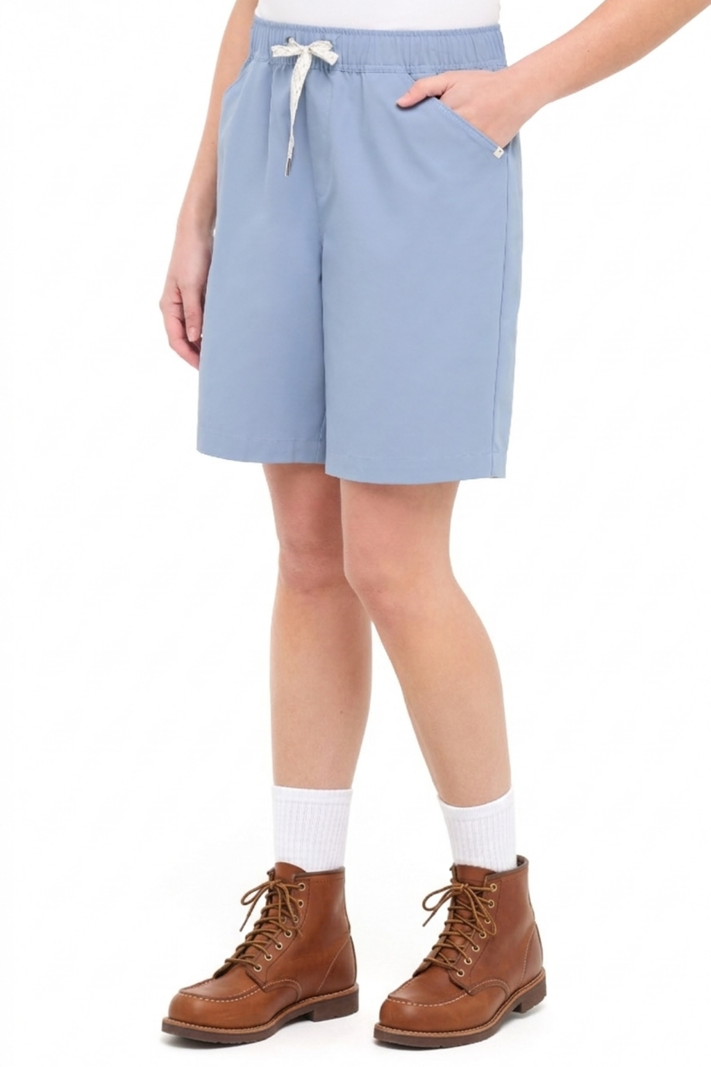 Front view of woman wearing light blue shorts with a white drawstring, standing on a white background. #color_troposphere