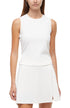 Front view of woman wearing a white sleeveless top and skirt set on a white background. 