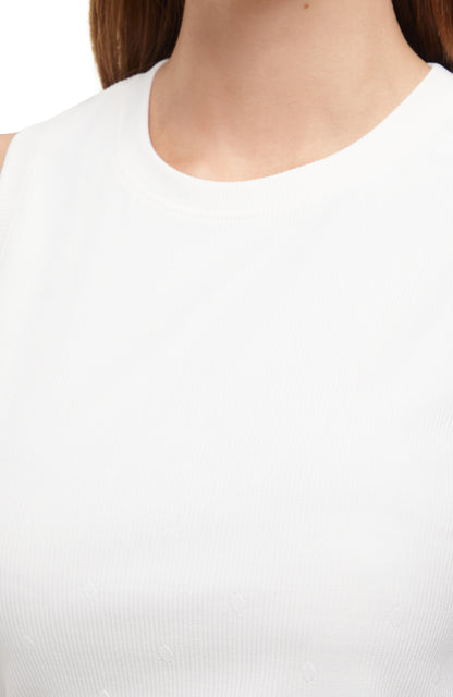 Close up neckline view of woman wearing a white sleeveless top and skirt set on a white background. 