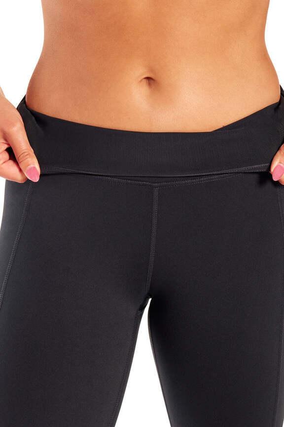 Olivia High Rise Tummy Control Legging - Black, alternate angle view, showing visible design features and texture of the stretch knit fabric. 