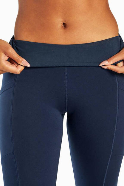 Talia Side Pocket Tummy Control Legging, side view showing pocket placement, showing visible design features and texture of the stretch knit fabric.. 