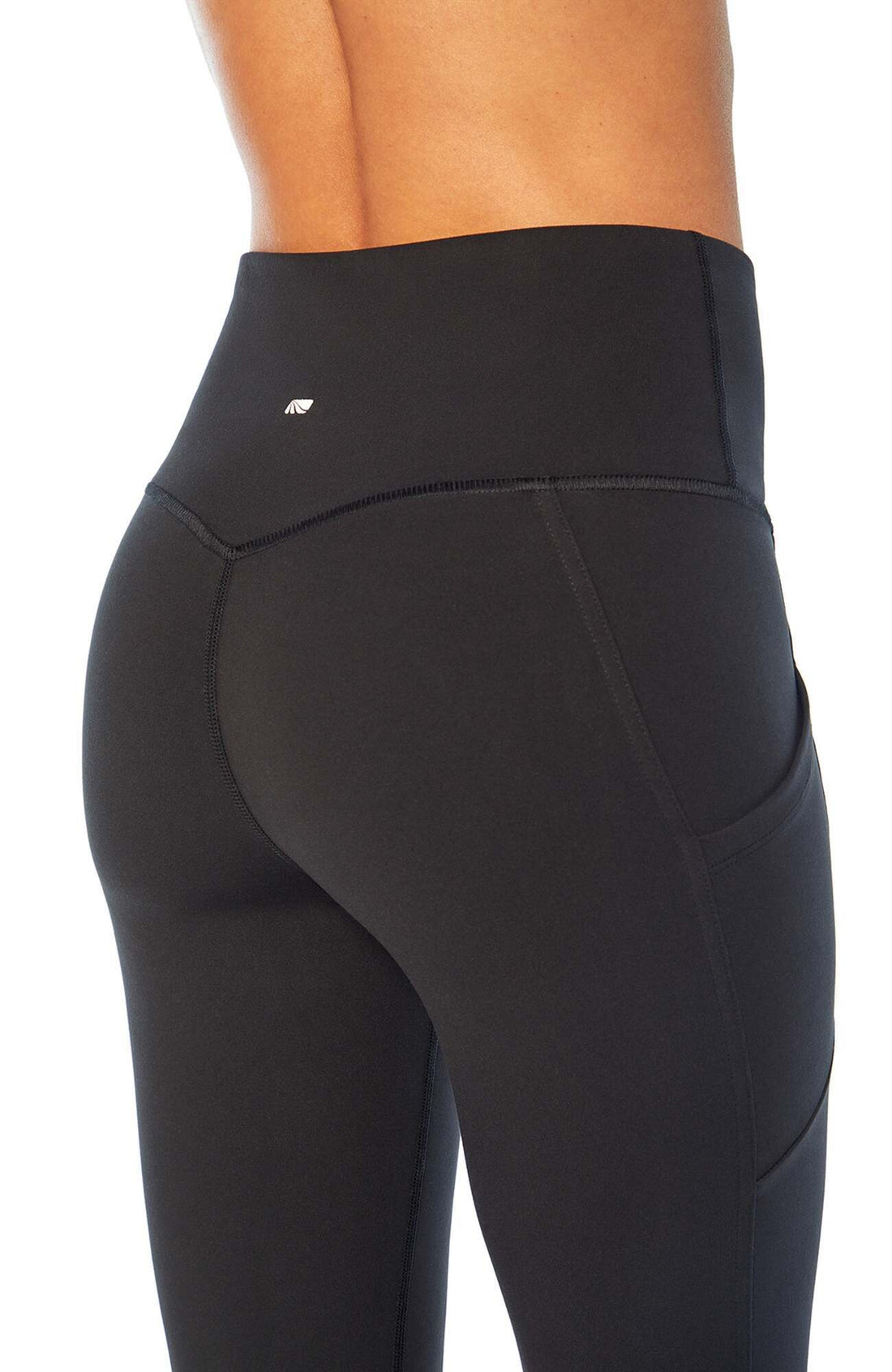 Olivia Side Pocket Tummy Control Bermuda Shorts, side view showing pocket placement, showing visible design features and texture of the soft knit.. 