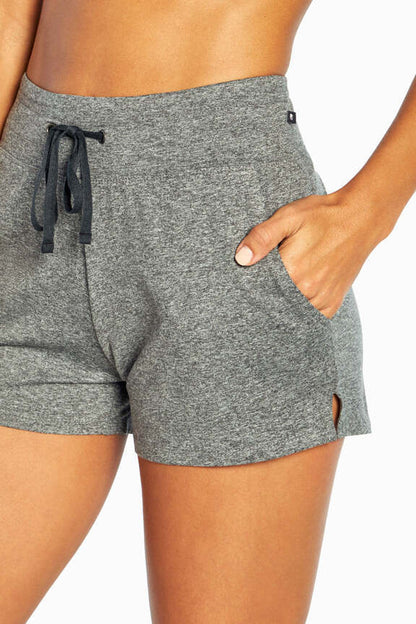 Mona Short, close-up view of fabric and stitching, showing visible design features and texture of the soft knit fabric.. 