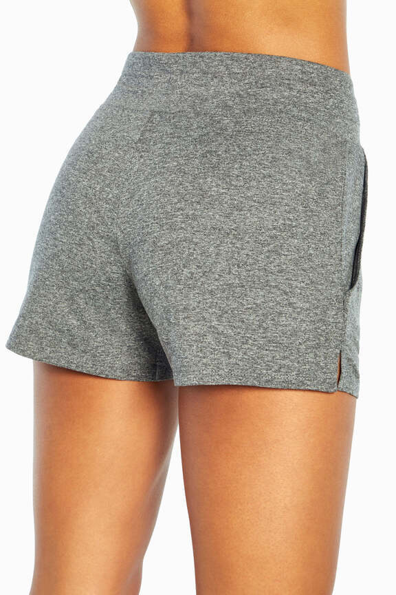 Mona Short, side view showing pocket placement, showing visible design features and texture of the soft knit fabric.. 
