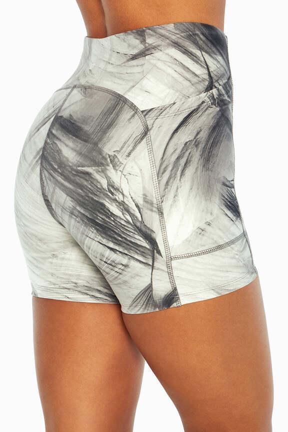 Emma Side Pocket Short, side view showing pocket placement, showing visible design features and texture of the soft knit fabric.. 